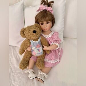 Show stoppers porcelain Brooke doll. Porcelain head, arms, legs. Body fabric.